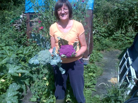 Here's me smiling with our Purple Cauliflower and Broccoli heads.  